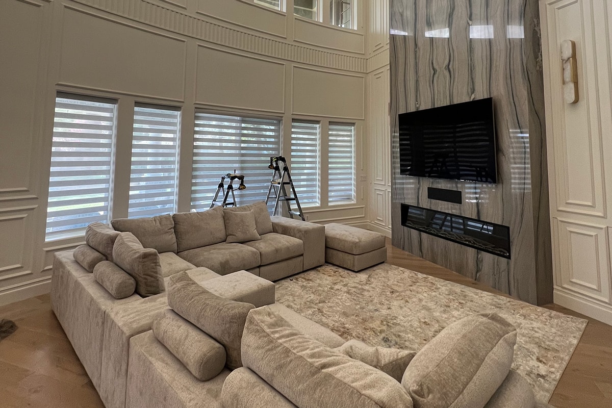 Technician on a follow-up service call in a finished residential interior