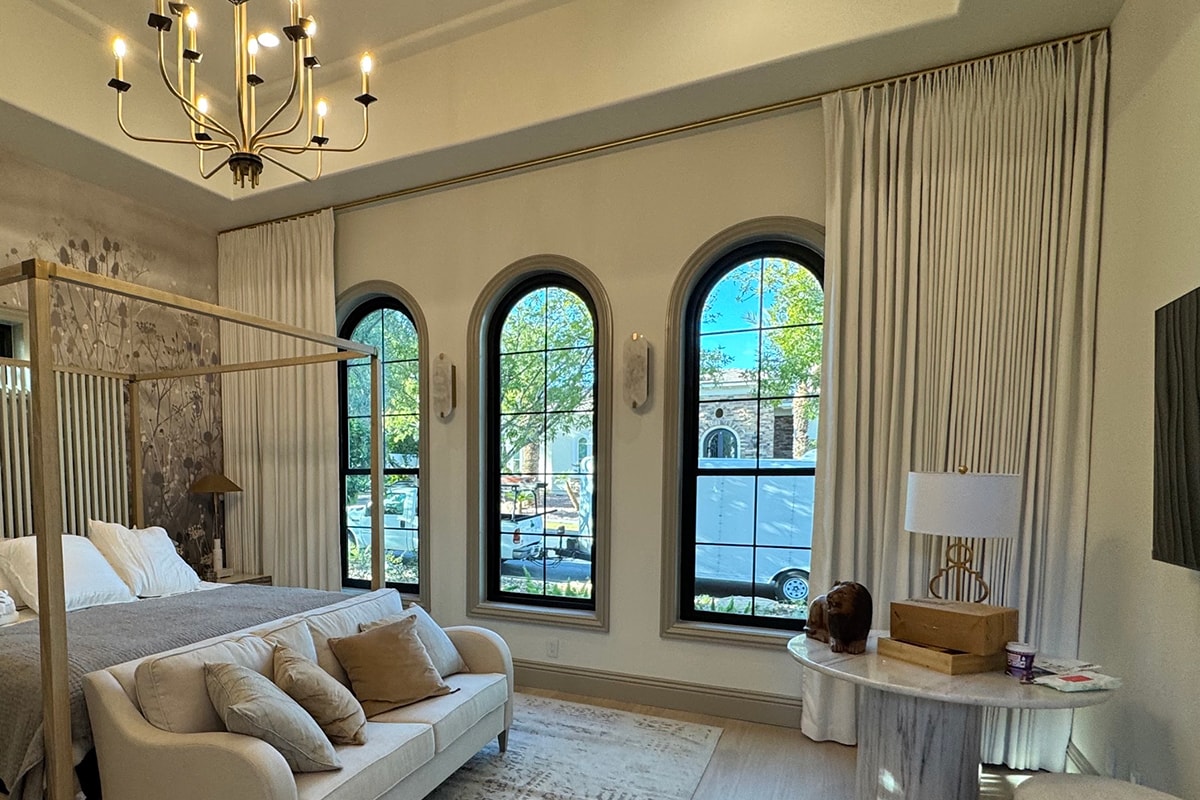 Designer reviewing a window with a homeowner during an in-home consultation